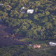 Image for article titled New aerial photos show Kilauea’s lava devouring neighborhoods